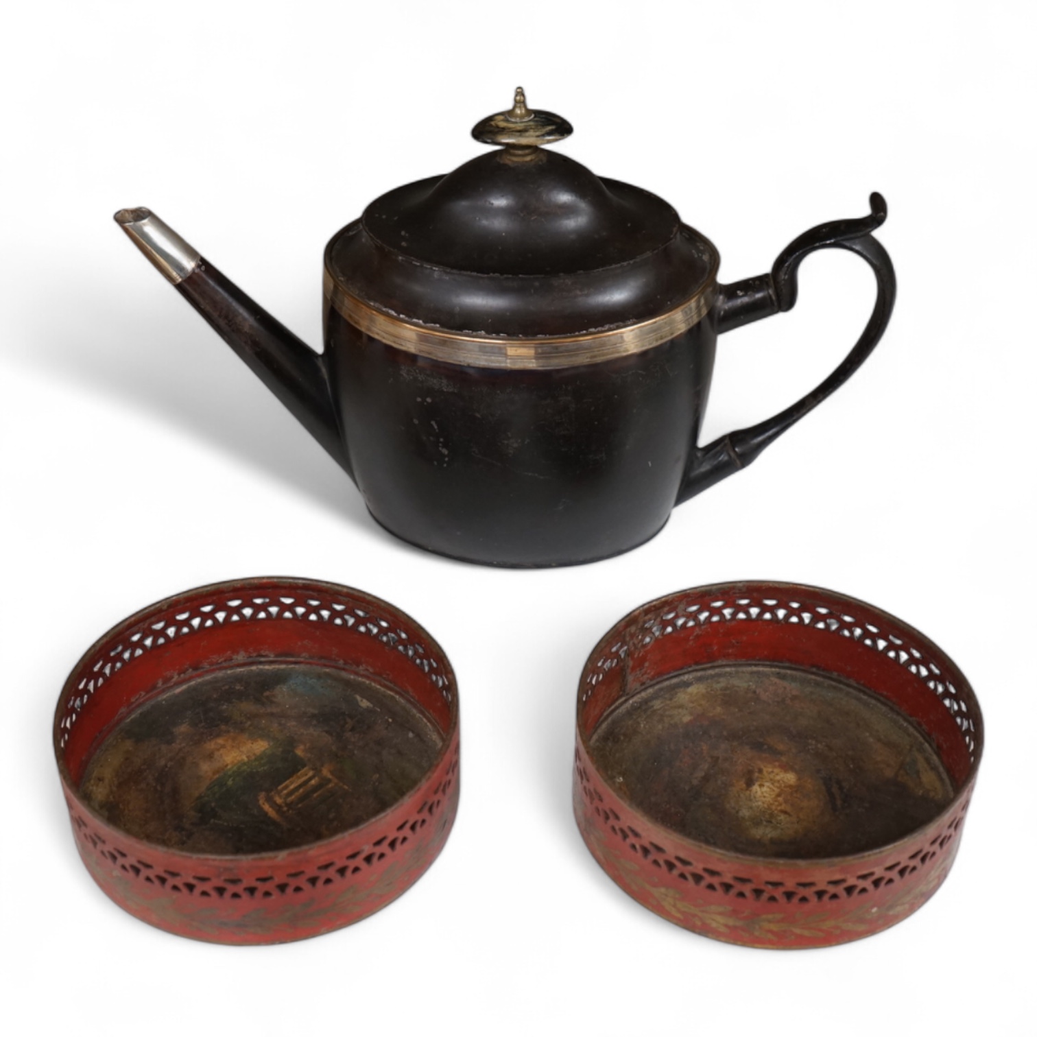 A George III silver and Old Sheffield plate mounted toleware teapot and a pair of red japanned toleware wine coasters, teapot 28cm wide (3)